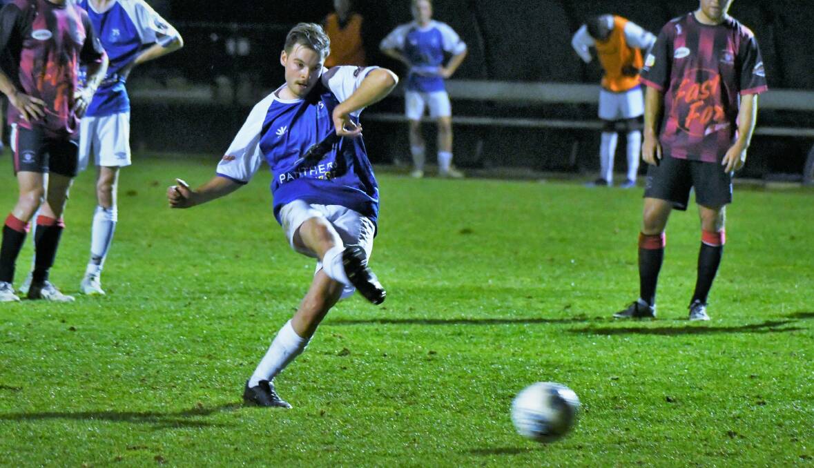 THE DIFFERENCE: Tom Rooke puts away the winning penalty goal in last round's game. Photo: CHRIS SEABROOK