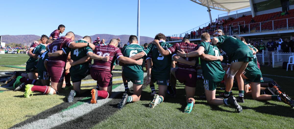 GOOD SPIRIT: Manly and Western Rams players form a circle at Glen Willow Sporting Complex following their match. Manly won the game 32-12. Photo: SIMONE KURTZ