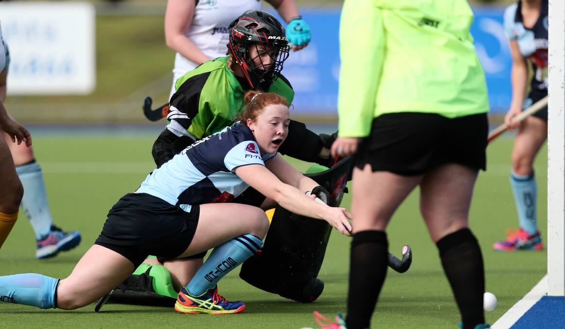 SCRAMBLE: The ball gets away from Emma White's reach during last round's loss to Orange CYMS. Photo: PHIL BLATCH