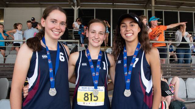 BIG PERFORMANCE: Mackillop College's highest finishers at the NSW All Schools Triathlon of Kalinda Robinson, Cushla Rue and Ella McPhillamy display their silver medals. Photo: CONTRIBUTED

