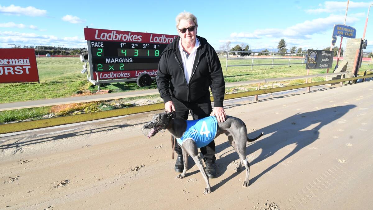 WHAT A SHOCK: Rob Harrison with his long-odds winner Simon Ralph at Kennerson Park. Photo: CHRIS SEABROOK