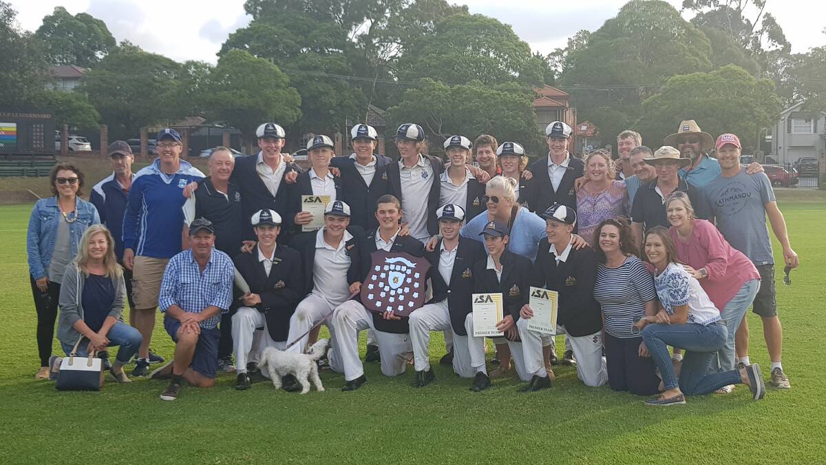 HAPPY CREW: St Stanislaus' College players, staff and family members celebrate after their ISA Cricket division one final triumph.