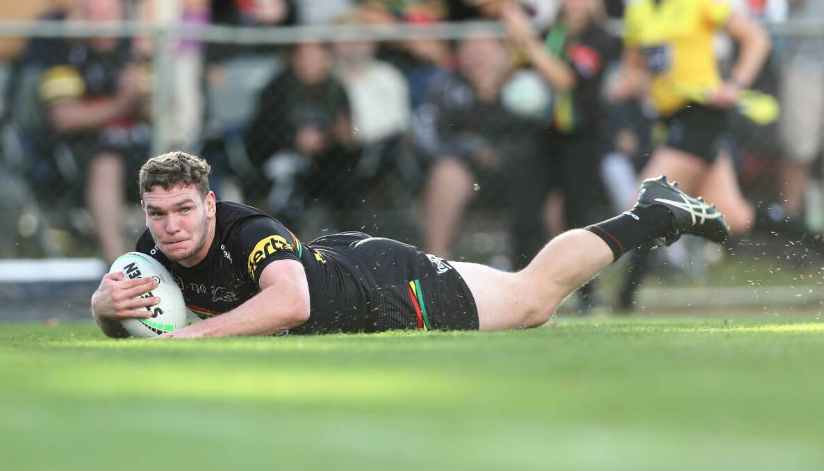 TRY TIME: Penrith Panthers' Liam Martin crosses for his try during Saturday's game against Manly at Bathurst's Carrington Park. Photo: PHIL BLATCH