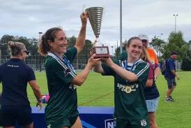 Bec Smyth and Sarah Colman hold the trophy aloft following Western Rams' grand final win. Picture supplied.
