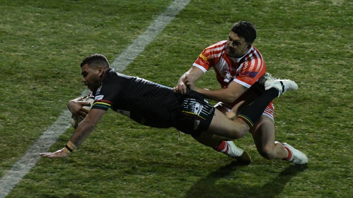 CAN'T STOP ME: Willie Wright dives over for a try with Mudgee's Corin Smith in pursuit. Panthers will go on to face Orange Hawks in the preliminary final. Photo: CHRIS SEABROOK 082419cpan4