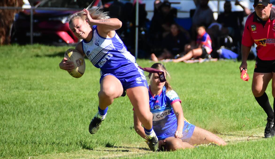 COME BACK HERE: St Pat's player Taneisha Pringle is pursued by a West Belconnen opponent during the final. Photo: KELSEY SUTOR