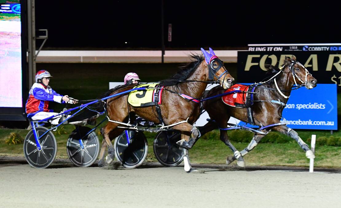 HERE I COME: Yes You May (right) runs by Chasing The Wind to win on Wednesday night. Photo: ALEXANDER GRANT