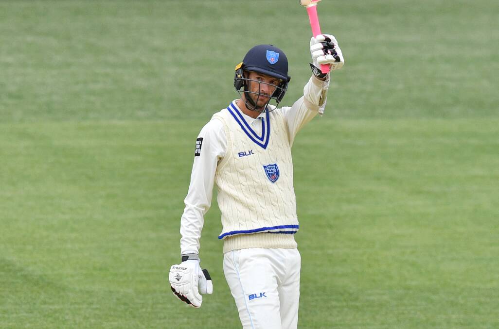 SAVIOUR: Trent Copeland raises his bat in Wednesday's opening Sheffield Shield innings after bringing up a half century with a six. Photo: AP