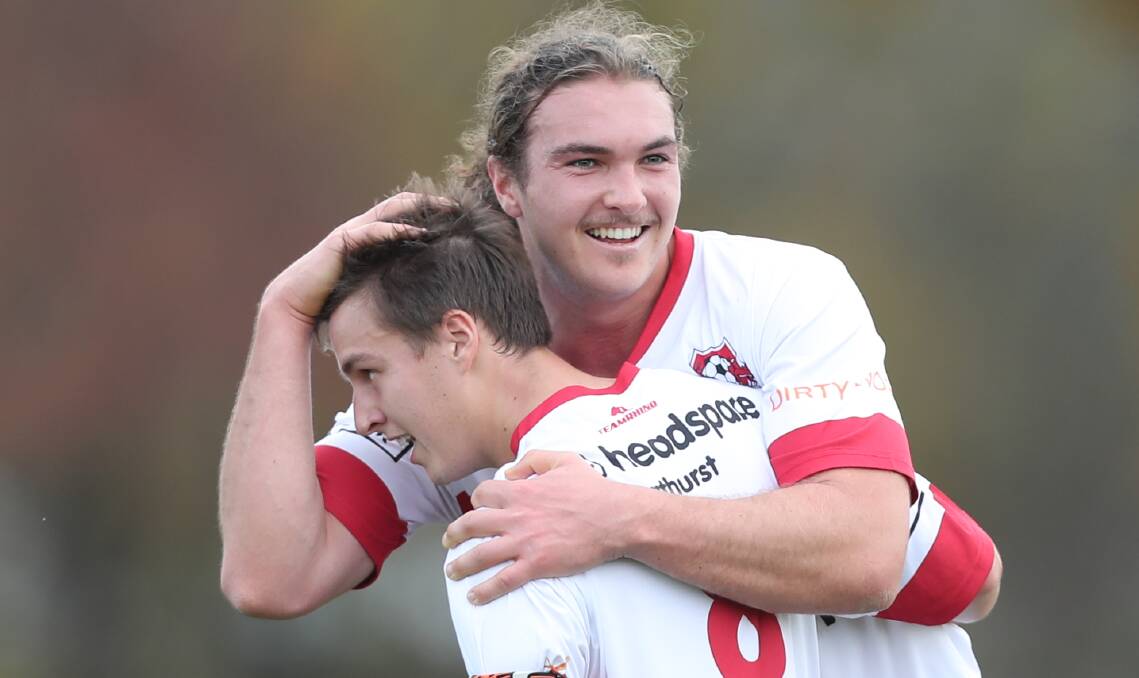 YOU BEAUTY: CSU captain Felix Croshaw is embraced by team-mate Callum Weafer after a goal against the Mudgee Wolves. Photo: PHIL BLATCH