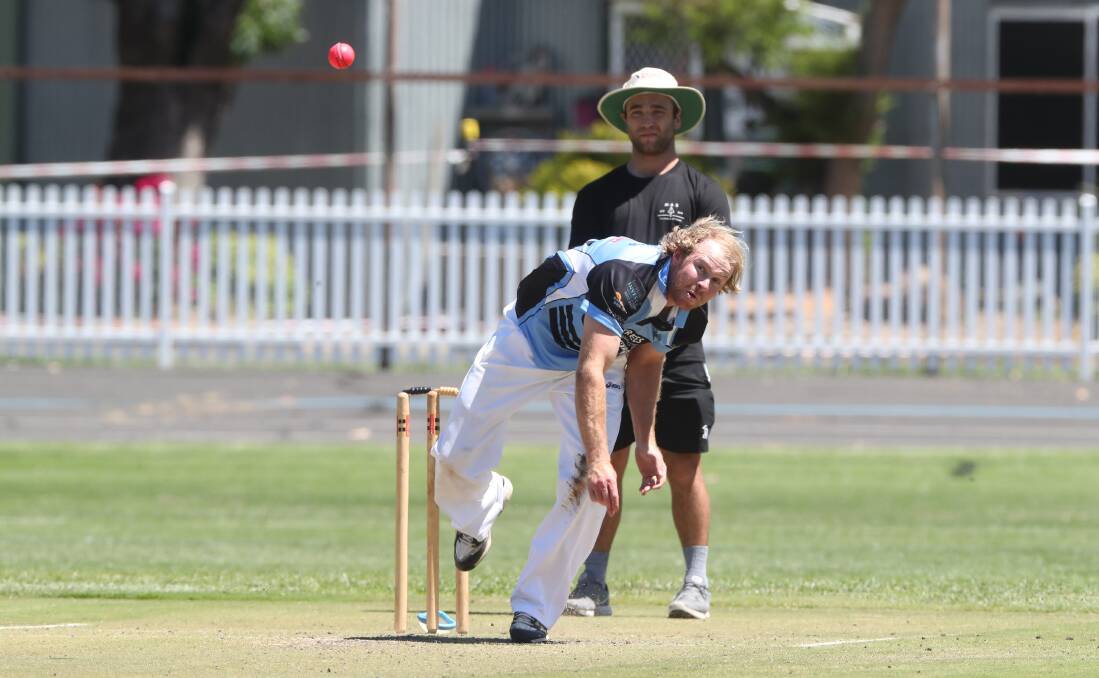 CHARGING IN: Angus Daymond bowls for City Colts. Photo: PHIL BLATCH