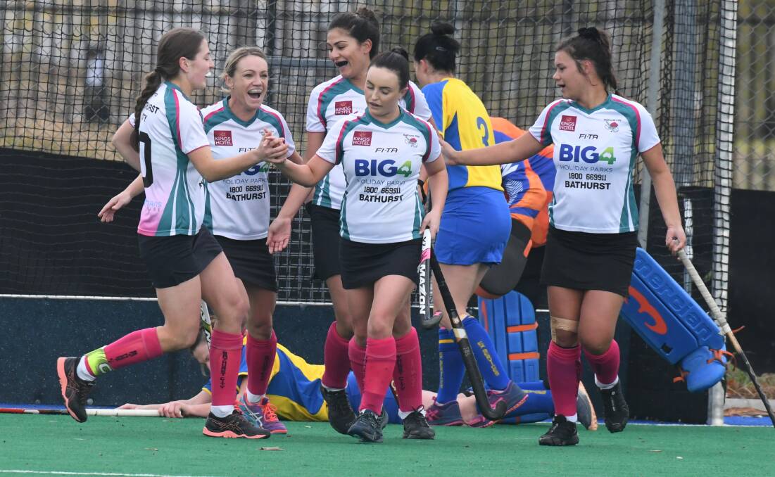 NICE ONE: Bathurst City players celebrate following a goal against Orange Ex-Services on Saturday. Photo: JUDE KEOGH