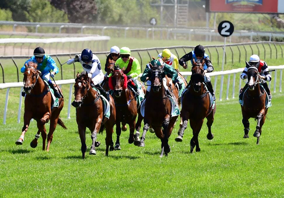 KEEPING THEM AT BAY: Into The Fire (second from left), under the guidance of Kathy O'Hara, charges to victory at Tyers Park on Monday in the Kennards Hire CG&E Class 1 Handicap (1,108 metres). Photo: ALEXANDER GRANT