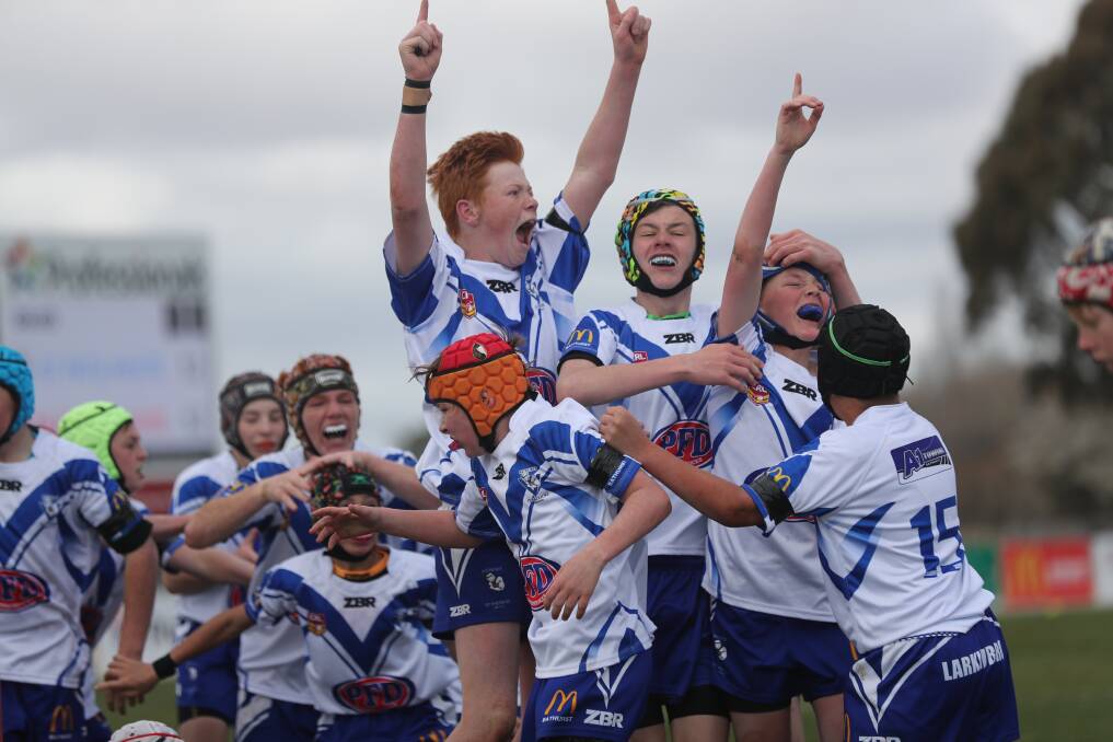 WE DID IT: Jubilant scenes unfolded when the St Pat's under 13s put a stop to the Mudgee Dragons' fhuge unbeaten run. Photo: PHIL BLATCH