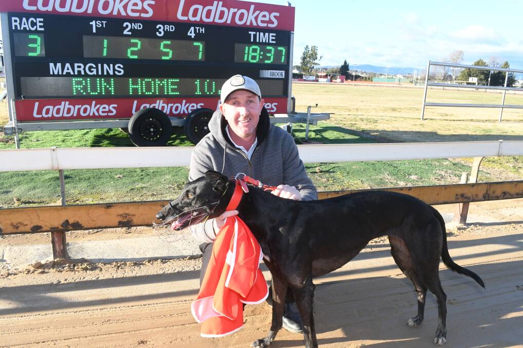 SAFE ON THE RAIL: Mark Wicks with his winning greyhound Grand Diva at Kennerson Park on Monday. Photo: CHRIS SEABROOK
