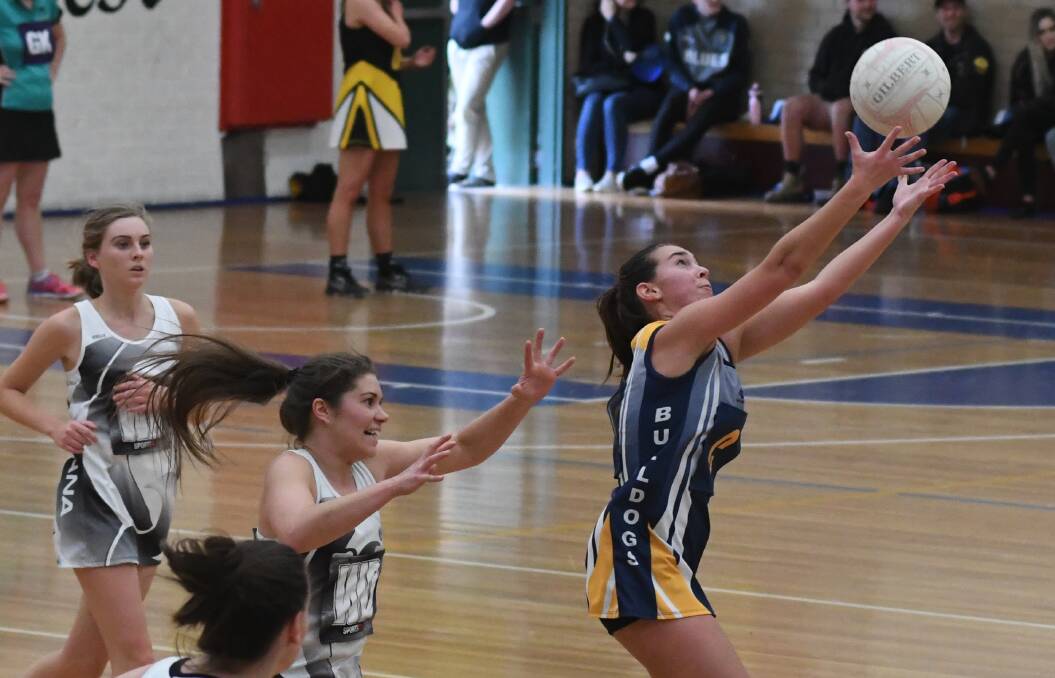 LEAPING: Lucy Hobson reaches out for a pass in Saturday's minor semi-final win over Mana. Photo: CHRIS SEABROOK