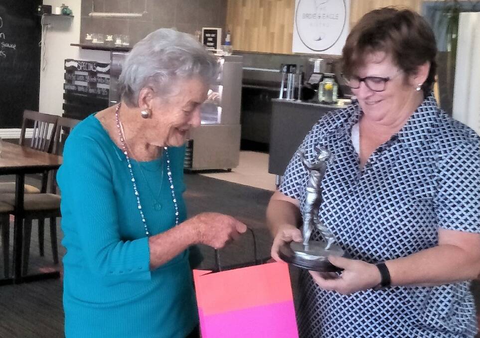 SUCCESS: Peg Oliver presents Mary Housler with the award. Photo: CONTRIBUTED