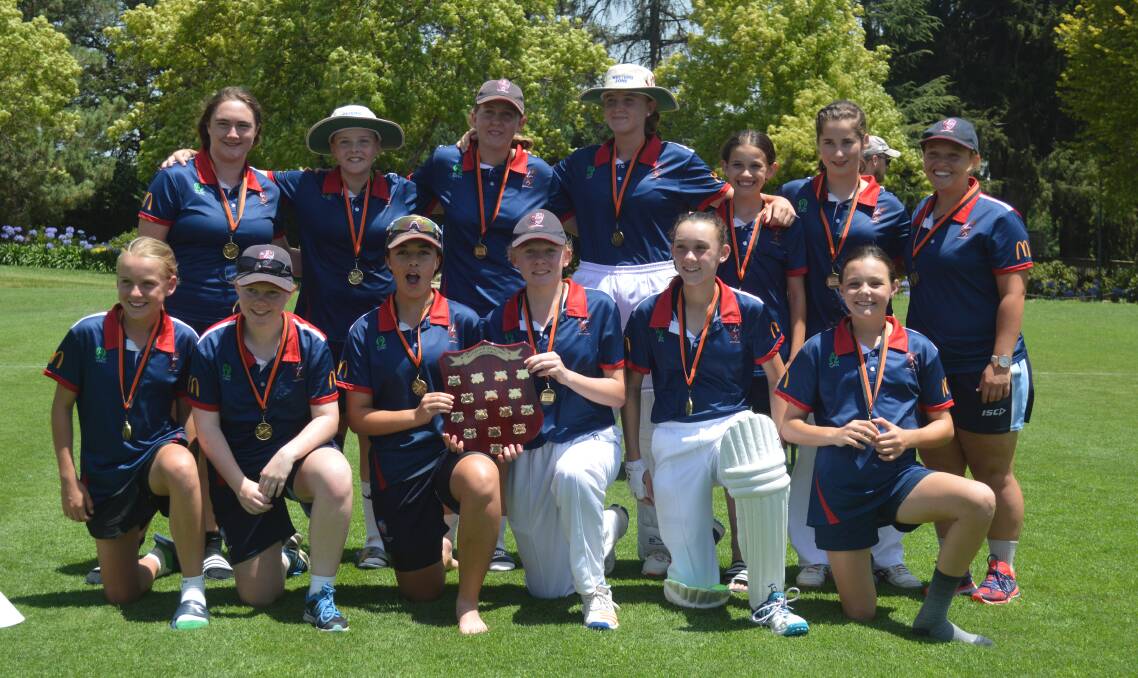 CHAMPIONS: The home side celebrates after claiming Western NSW Under-15 Girls’ Carnival grand final victory. Photo: JUDE KEOGH