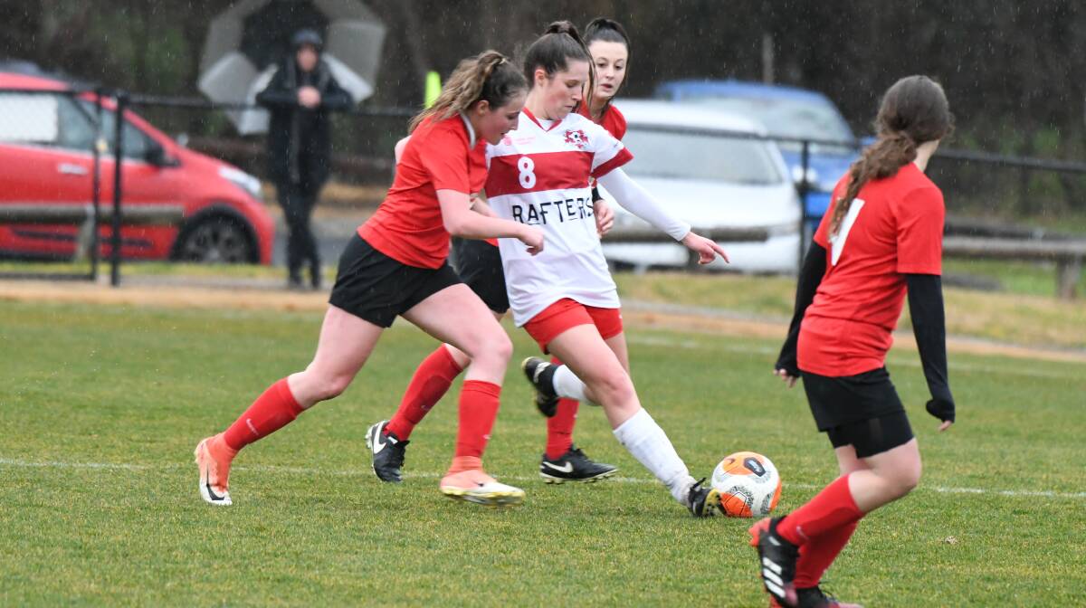 CLOSE CLASH: Panorama FC and CSU FC played out a 3-all draw in their Sunday Bathurst District Football women's premier league game. Photo: CHRIS SEABROOK