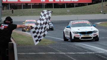 Jayden Ojeda takes the chequered flag at the Bathurst 6 Hour. Picture by James Arrow.