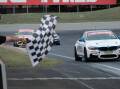 Jayden Ojeda takes the chequered flag at the Bathurst 6 Hour. Picture by James Arrow.