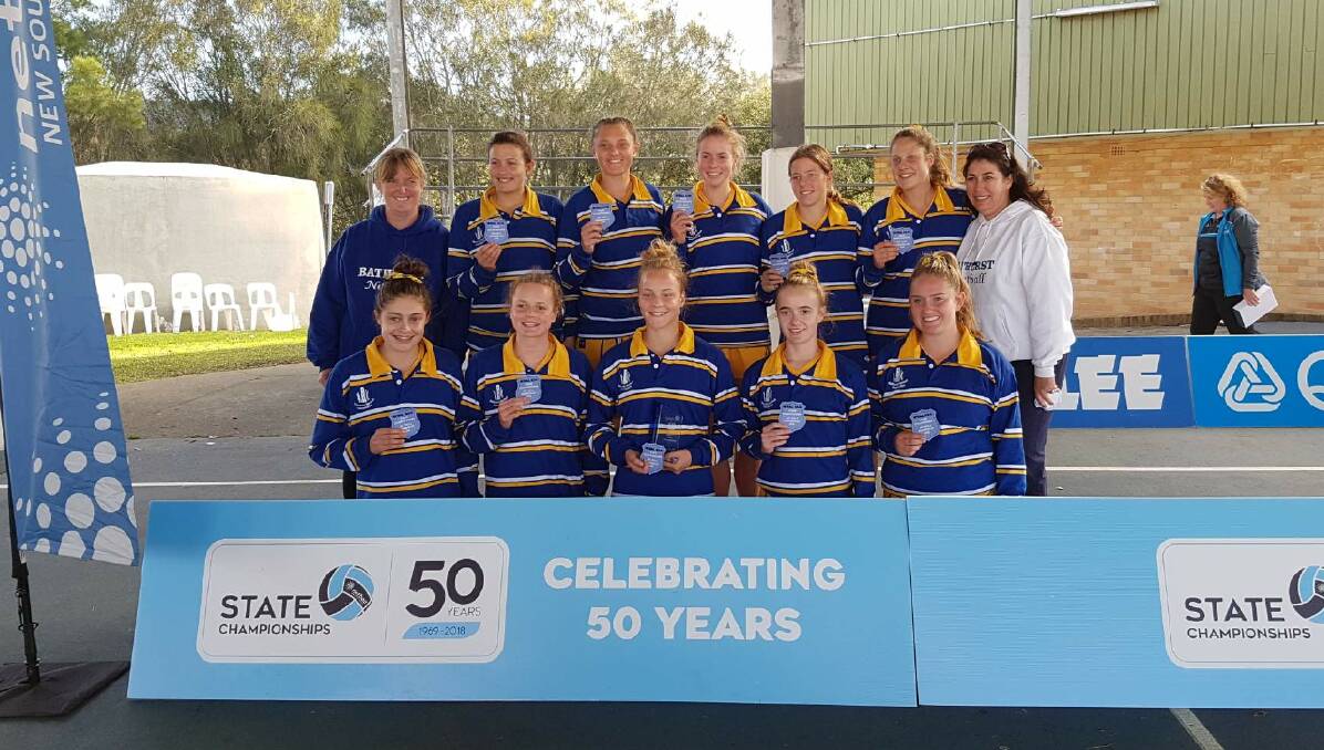 SILVER RESULT: Bathurst's under 17s netball side celebrate their division two runner-up finish at the State Championships.