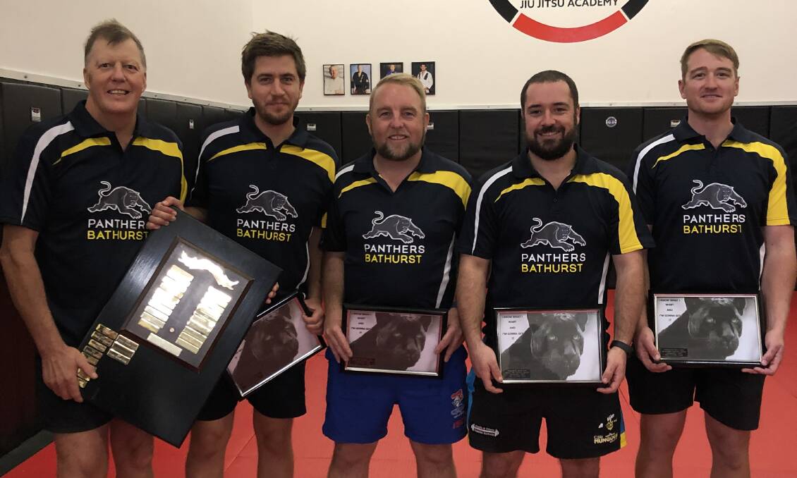 TITLE TIME: Bathurst's Dave Fuller with the B grade winning team of Pat Edsall, Clint Bryant, Evan Jones and James Gallagher. Photo: CONTRIBUTED