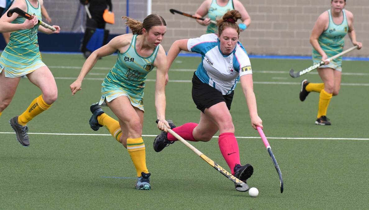 SOLID START: Sarah McCusker (right) and Bathurst City claimed a 1-all draw against CYMS. Photo: JUDE KEOGH