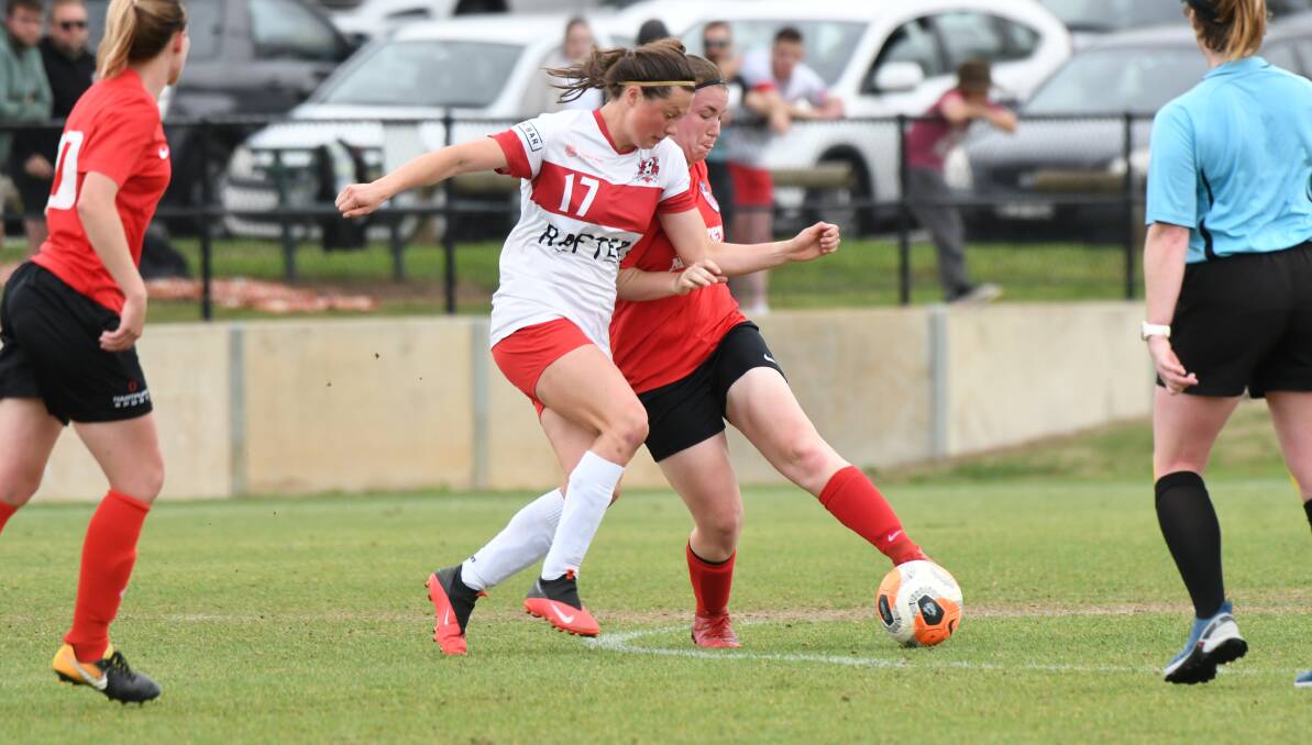 CLOSE CALL: Sarah Colman (right, pictured against CSU) was a goalscorer in Panorama FC's win. Photo: CHRIS SEABROOK