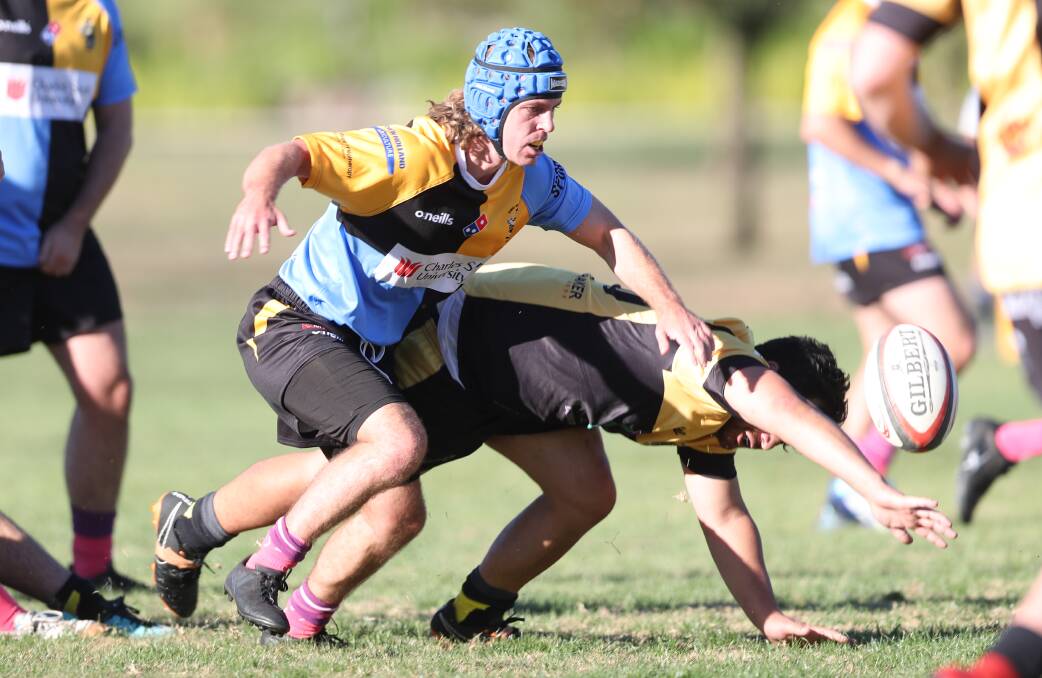 EYES ON THE PRIZE: Charlie Mansfield prepares to dive on a loose ball during CSU's match at home against the Dubbo Rhinos on Saturday. Photo: PHIL BLATCH