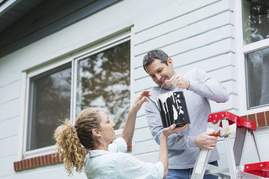 TEAMWORK: To make the job easier, encourage members of your family to help with the next painting project. Photo: Supplied