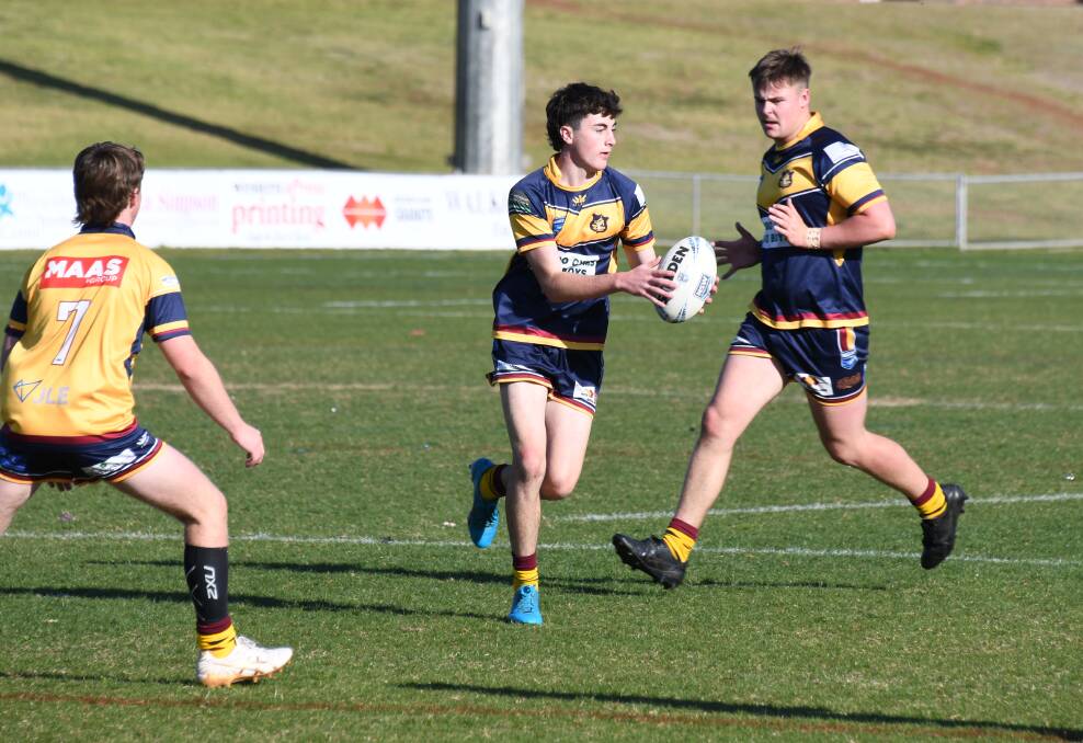 Darby Haycock in action for St John's Blue in last year's DDJRL under 16s grand final. Picture by Nick Guthrie