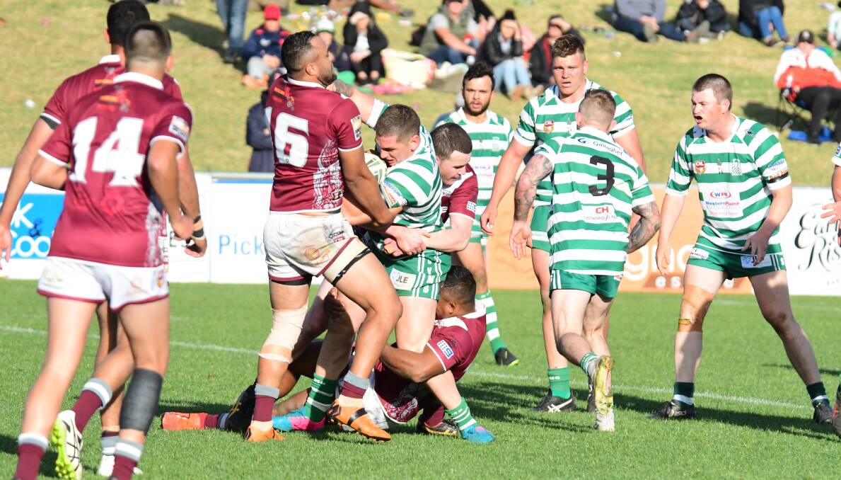 CHALLENGE: CYMS' Corey Cox crashes into the Wellington defence in this year's Group 11 grand final. There is a chance the clubs could be playing against Mudgee in 2020. Photo: BELINDA SOOLE