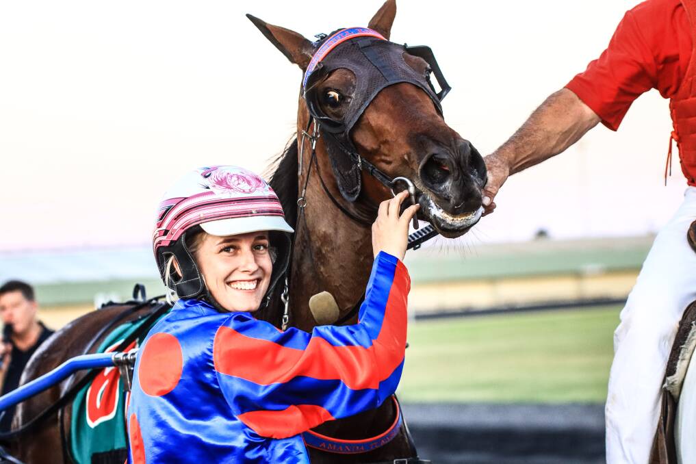 ALL SMILES: Isobel Ross had plenty of reason to be happy after Friday's dominant win with Gotta Party Doll. Photo: COFFEE PHOTOGRAPHY