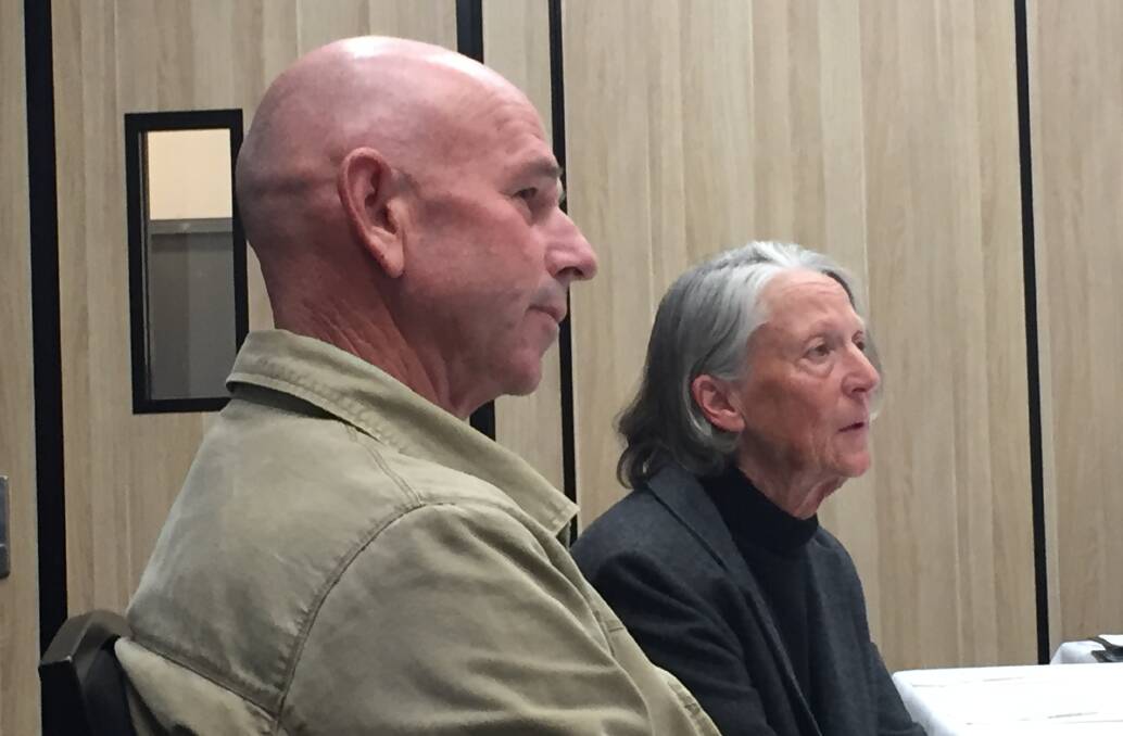 ANGRY: Williamtown residents Jenny and Terry Robison addressing the federal government inquiry into PFAS contamination in Williamtown on Tuesday.