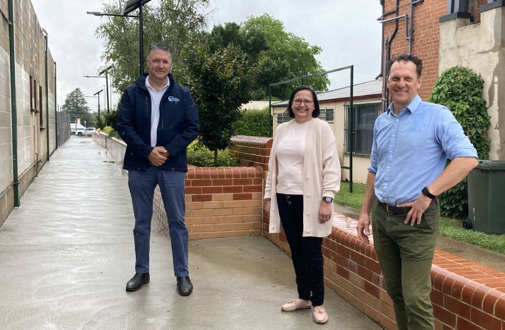 TRIBUTE: Peter Wright, Lisa Mallon and Jess Jennings in the walkway off Keppel Street that is set to be named after Alan Wright. Photo: JACINTA CARROLL