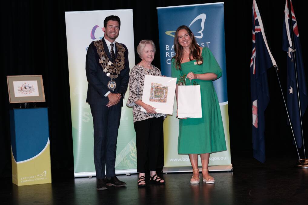 Kaye Price (centre) with deputy mayor Ben Fry and Australia Day ambassador Lottie Dalziel. Picture by James Arrow