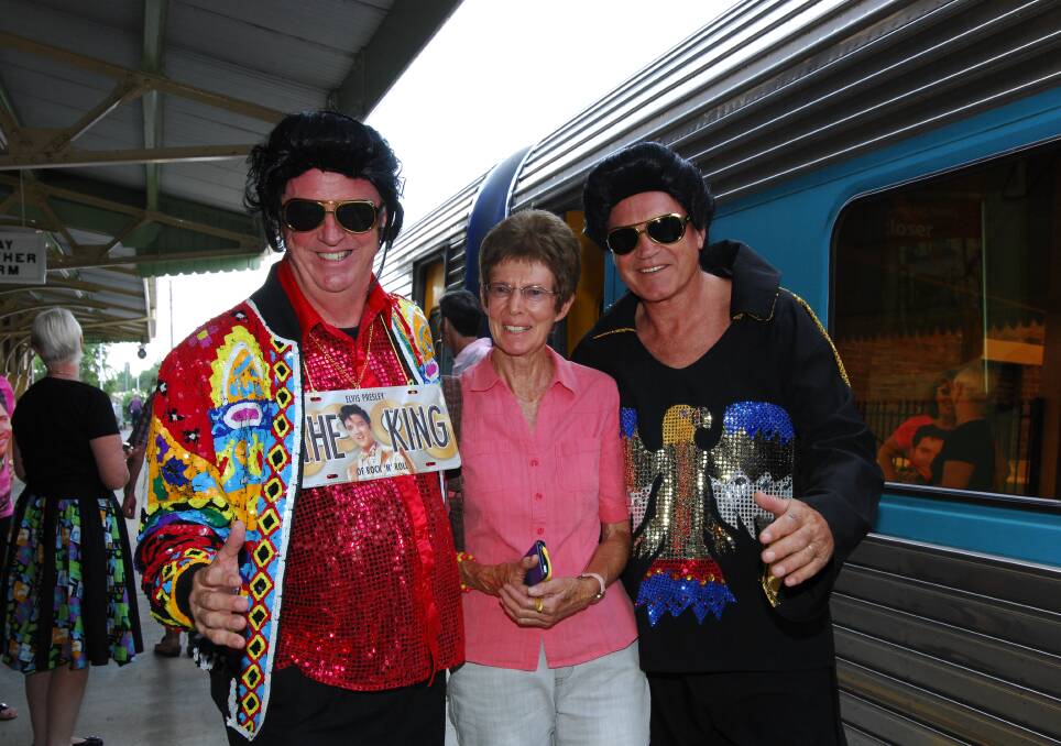 SEEING DOUBLE: Local woman Carol Whyte was thrilled to meet two Elvis lookalikes when the Elivs Express rolled into Bathurst a few years ago. Photo: ZENIO LAPKA 010815zelvis
