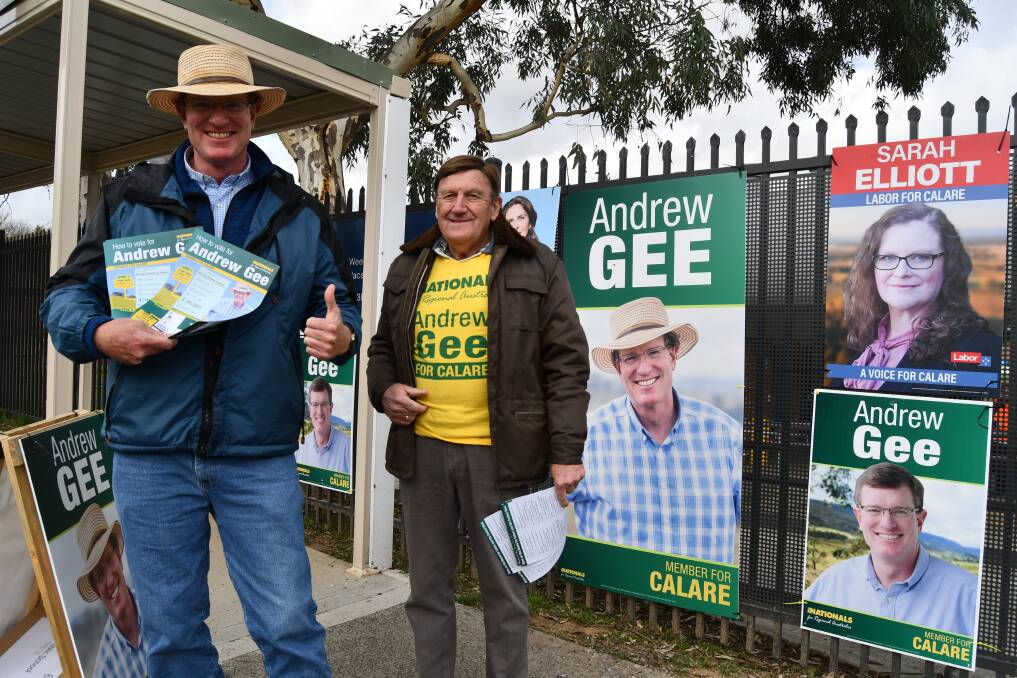 Incumbent Andrew Gee alongside one of his campaign volunteers outside the Kelso Public School polling centre. Photo: RACHEL CHAMBERLAIN