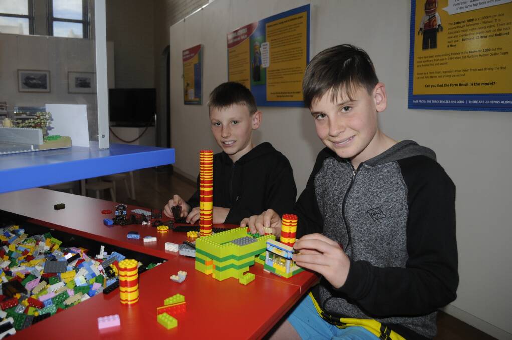 FUN: Brothers Jack, 11, and Sam, 13, Hopkins from Taupo, New Zealand playing with the LEGO display at the Australian Fossil and Mineral Museum. Photo: CHRIS SEABROOK 