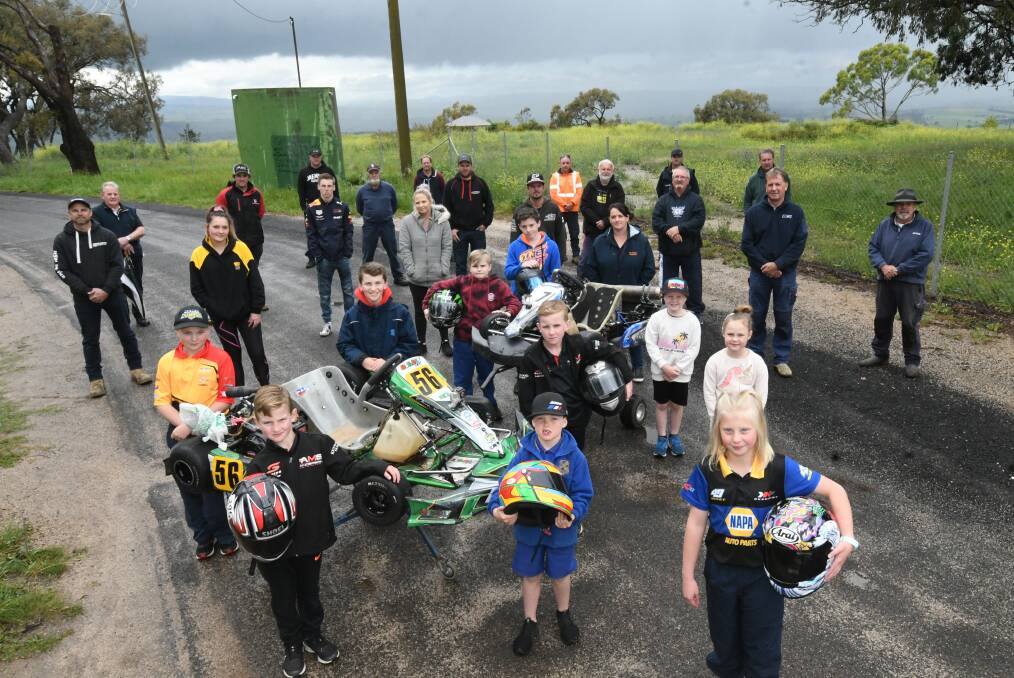 HOPEFUL: Some of the members of Bathurst Kart Club near the site for the go-kart track. They hope council will stand by its decision. Photo: CHRIS SEABROOK 102720cgokarts