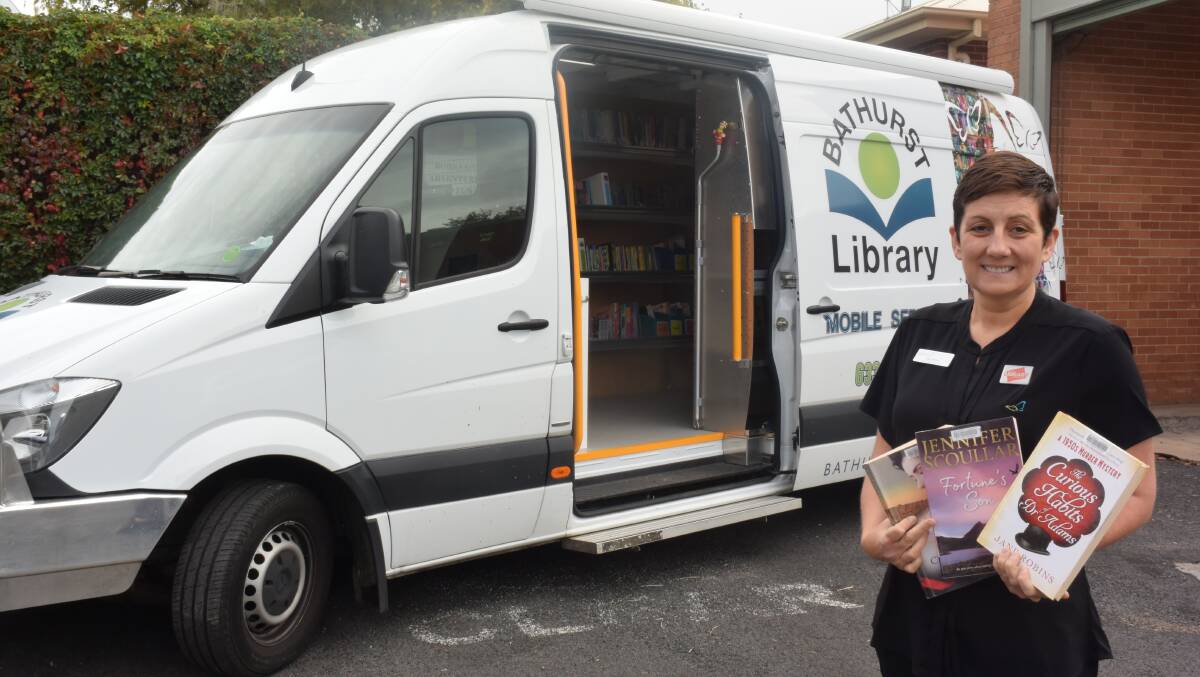 STILL ON THE ROAD: Driver Melinda Short with the Bathurst mobile library, which is still operating in the community. Photo: RACHEL CHAMBERLAIN