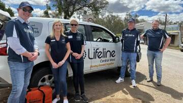 Lifeline staff and volunteers in Eugowra in 2022 following the major flood event. Picture supplied by Lifeline Central West