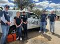 Lifeline staff and volunteers in Eugowra in 2022 following the major flood event. Picture supplied by Lifeline Central West