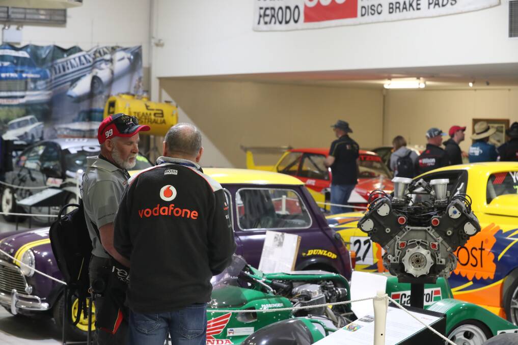 LOOKING AROUND: Race fans enjoy the chance to look at the cars and bikes that are on display in the National Motor Racing Museum. Photo: PHIL BLATCH