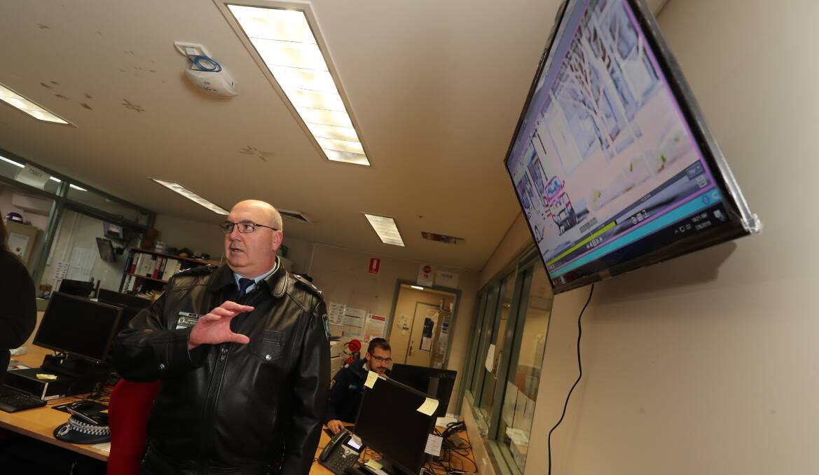 FLASHBACK: Superintendent Paul McDonald at Bathurst Police Station with a screen displaying live images from one of the closed-circuit television (CCTV) cameras installed under stage one. Photo: PHIL BLATCH 070919pbcctv2