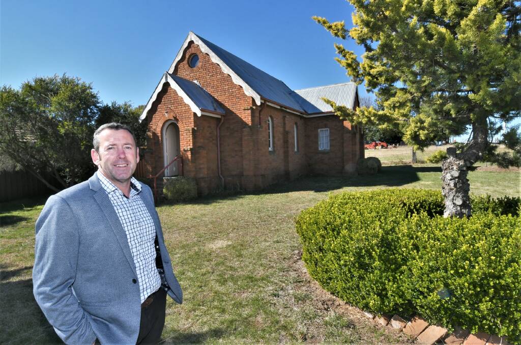 ON THE MARKET: Real estate agent David Chapman outside the St James' Anglican Church in Raglan. Photo: CHRIS SEABROOK 051921church