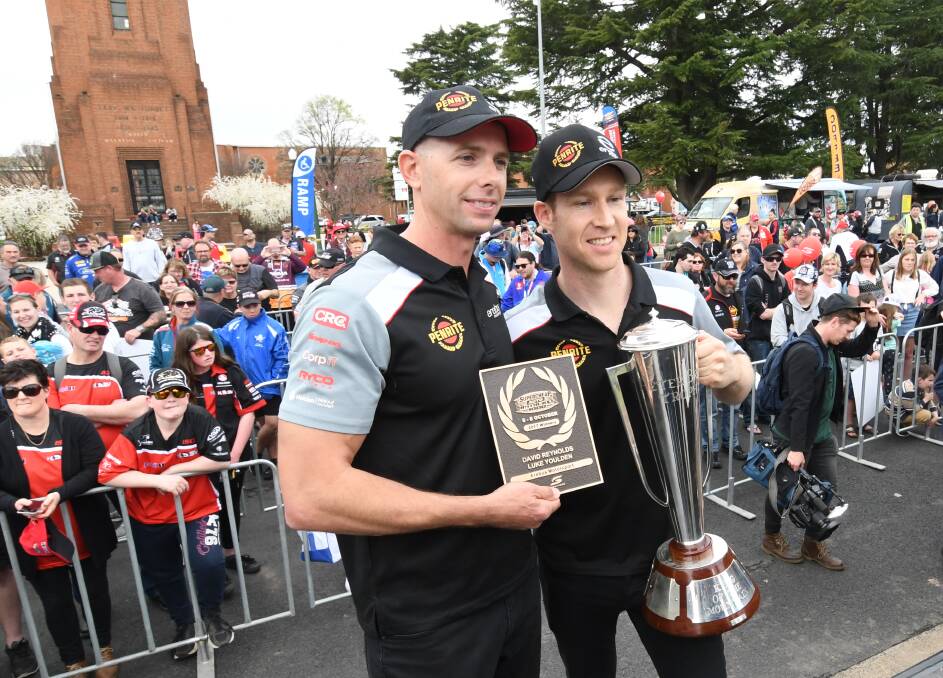 PART OF HISTORY: Winners of the 2017 Bathurst 1000, Luke Youlden and David Reynolds, with their plaque and the Peter Brock Trophy. Photo: CHRIS SEABROOK 
