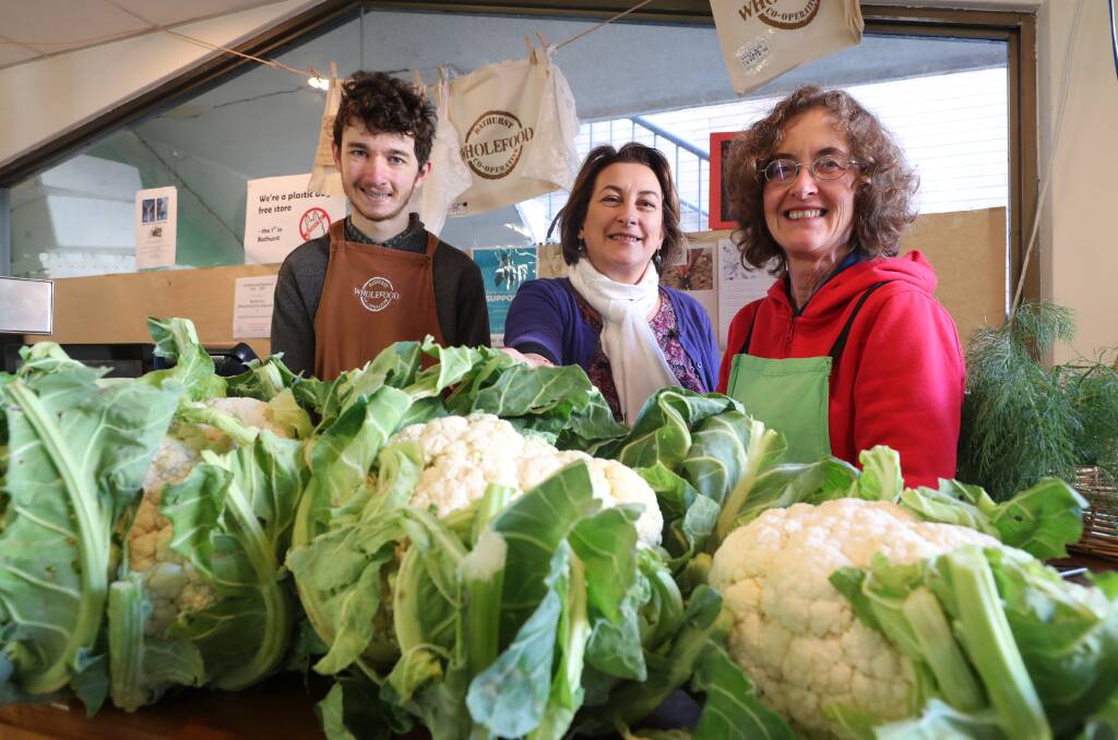 TEAM: The Bathurst Wholefood Co-op'sTim Downs, Denise O'Grady and Wendy Inwood with produce. Photo: PHIL BLATCH 080319pbdrought1
