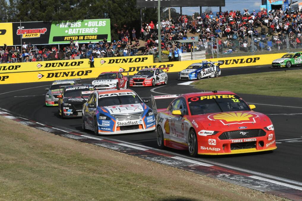 FILE PHOTO: Cars coming around the final corner at the 2019 Bathurst 1000. Photo: CHRIS SEABROOK