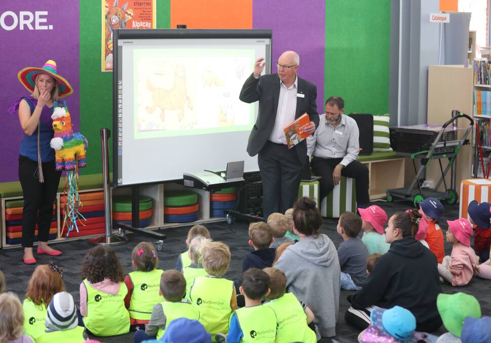 ATTENTIVE AUDIENCE: All eyes were on mayor Graeme Hanger when he read Alpacas with Maracas at the library. Photo: PHIL BLATCH 052219pbstory1